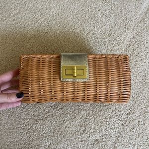 Straw clutch with gold accents